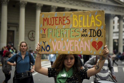 Women demonstrate on April 11, 2017 at Plaza de Mayo square in Buenos Aires against gender violence and in solidarity with Argentina's latest femicide victim, 21-year-old Micaela Garcia, a "Ni Una Menos" (Not One Less) movement activist, whose body was found Saturday in a rural field in Gualeguay, Entre Rios province. A feminicide occurs every 30 hours in Argentina. / AFP PHOTO / EITAN ABRAMOVICH