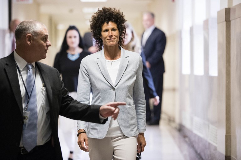 Andrea Constand walks to the courtroom during Bill Cosby's sexual assault trial at the Montgomery County Courthouse on June 6, 2017 in Norristown, Pennsylvania. Bill Cosby's trial for sexual assault opened June 5, 2017 in Pennsylvania with tearful testimony from one of his alleged accusers as prosecutors painted the megastar turned pariah as a sexual predator who established trust with younger women before incapacitating them with drugs and wine. / AFP PHOTO / POOL / Matt Rourke