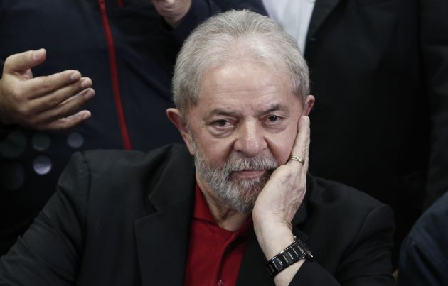 Former Brazilian president Luiz Inacio Lula Da Silva gestures during a press conference in Sao Paulo, Brazil on July 13, 2017. Brazil's former president Luiz Inacio Lula da Silva said on Thursday -- a day after he was convicted and sentenced for graft -- that judges and political opponents were "destroying democracy." In his first public reaction to the verdict handed down on Wednesday, Lula implied the judgment was aimed at preventing him being a comeback candidate in presidential elections next year. "They're destroying democracy in our country," he told reporters in Sao Paulo.  / AFP PHOTO / Miguel SCHINCARIOL