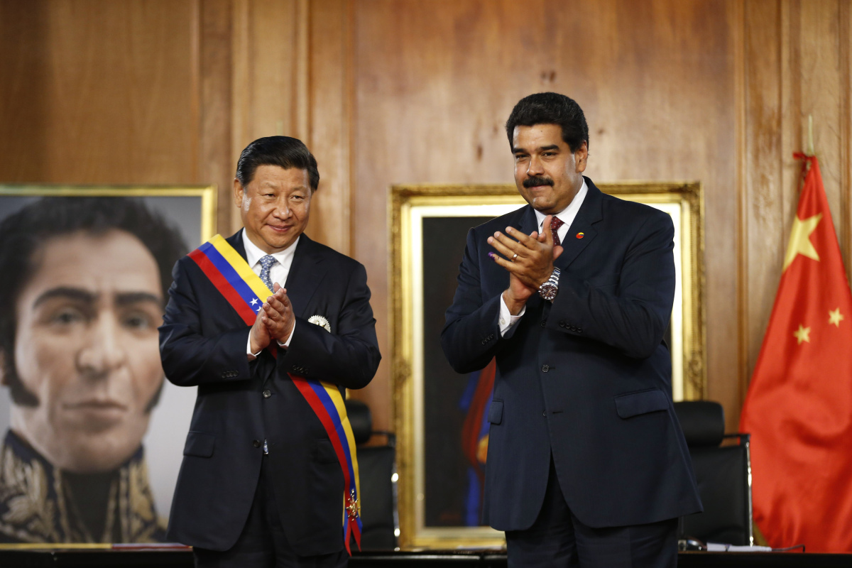 China's President Xi claps with his Venezuelan counterpart Maduro, at their meeting at Miraflores Palace in Caracas