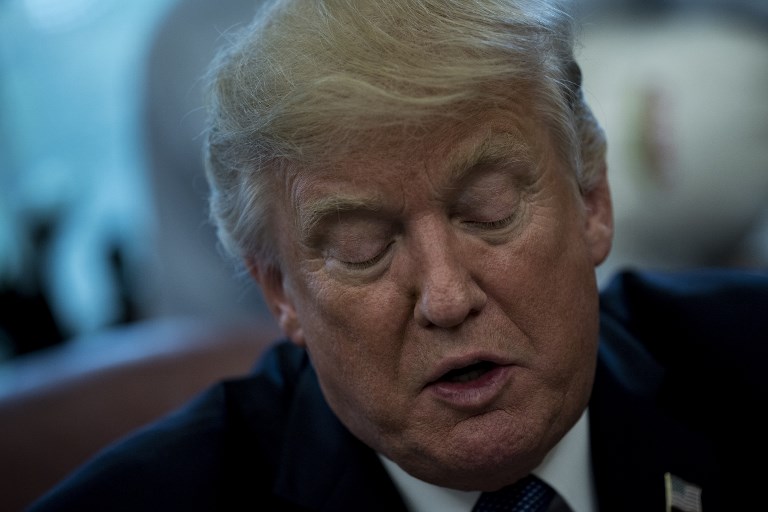 US President Donald Trump speaks about business during a proclamation signing in the Oval Office of the White House October 6, 2017 in Washington, DC. / AFP PHOTO / Brendan Smialowski